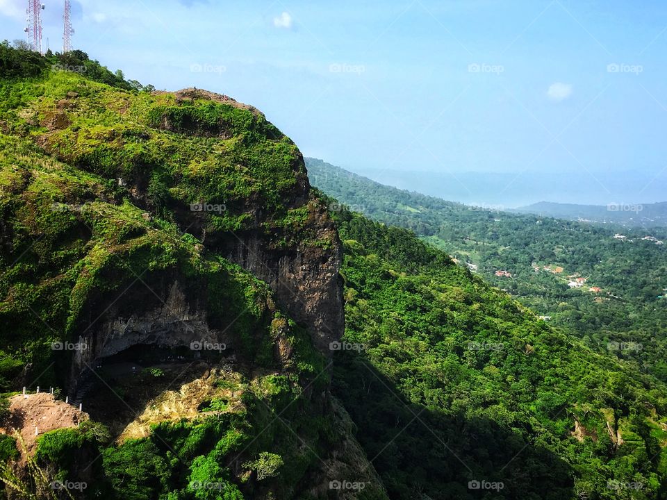 Cave in lush mountain 