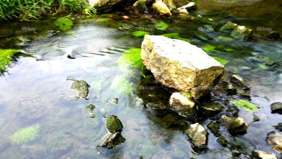 Morning, the water flowing in the mountain stream