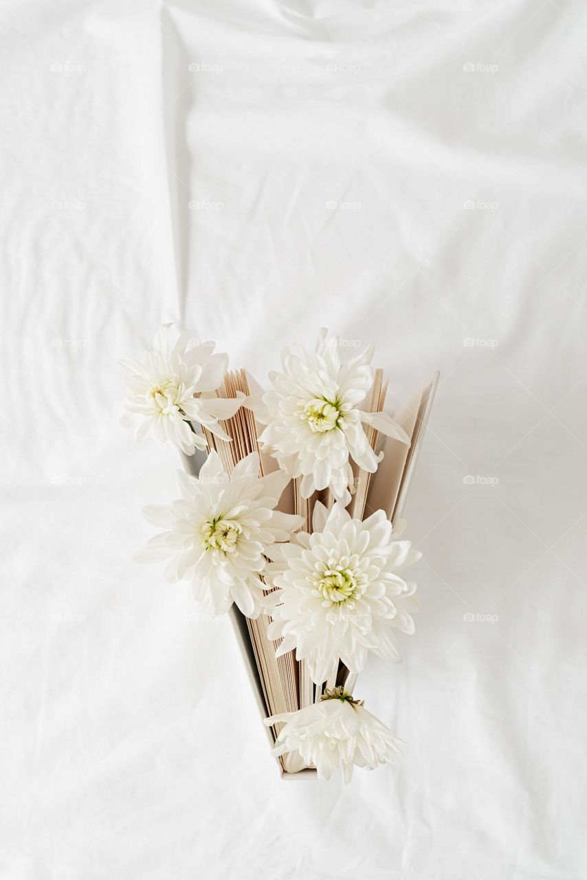 white flowers in book