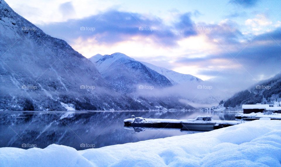 Snowcapped mountain reflected on lake