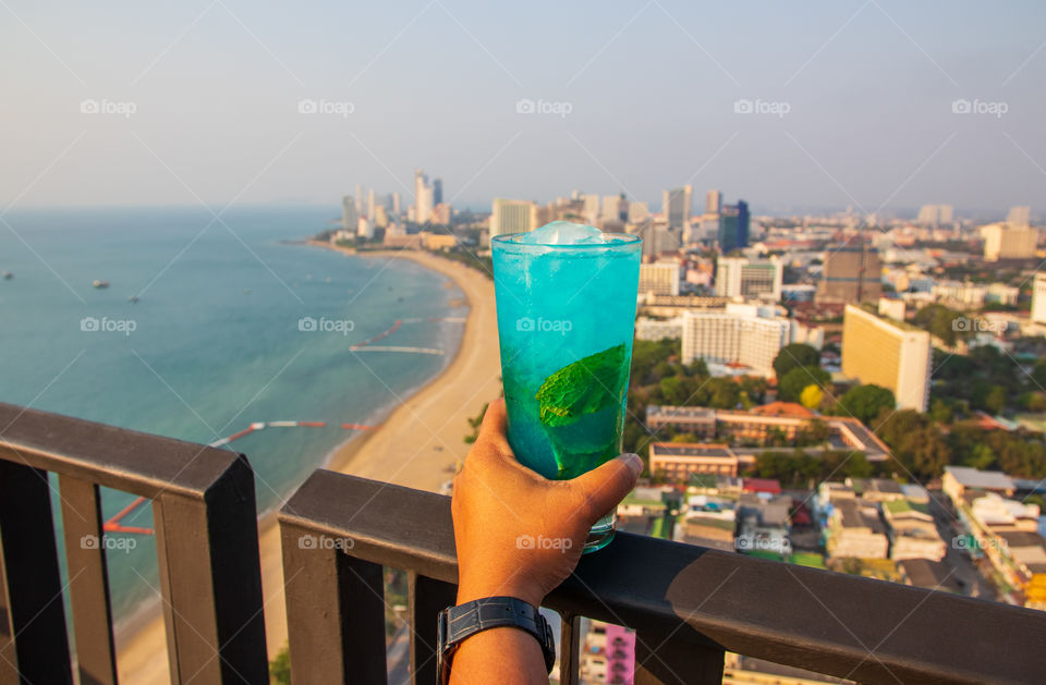 One ice cold blue Mojito Cocktail at a Rooftop Bar in Thailand Southeast Asia during the hot summertime