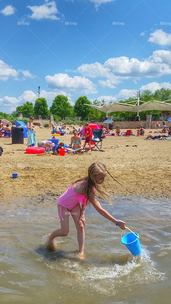 gathering water for a sand castle