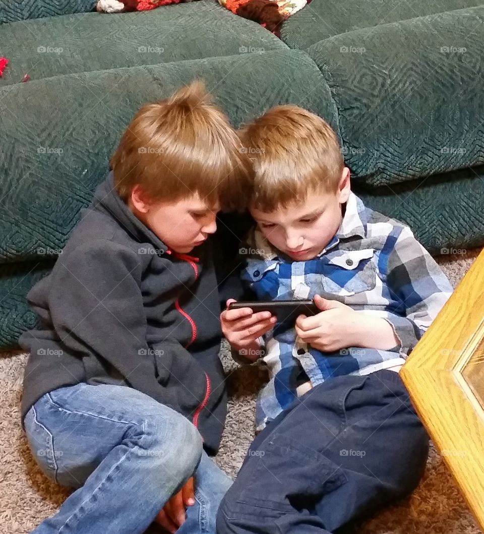 2 boys with technology