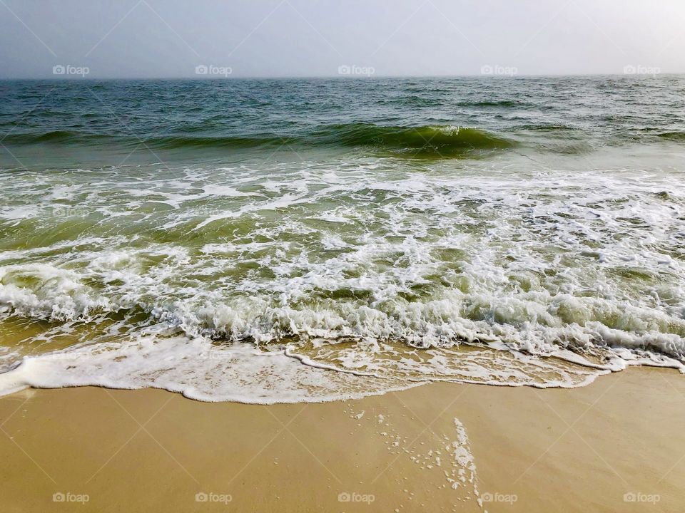 Seascape with blue sky no clouds on the beach 