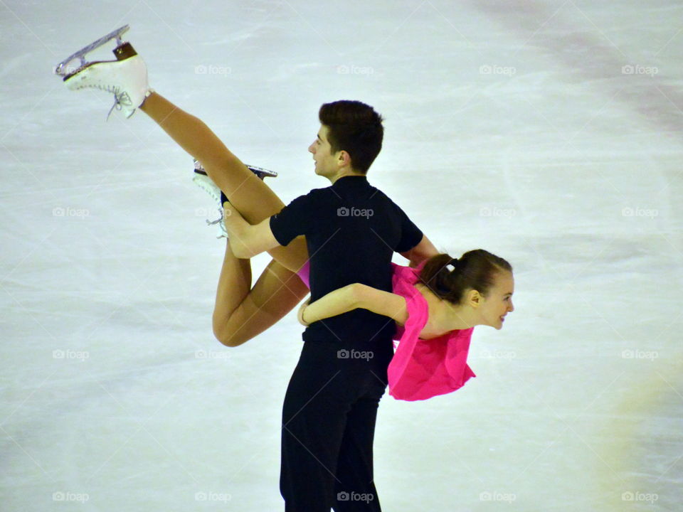 ice skating, dancing couple
