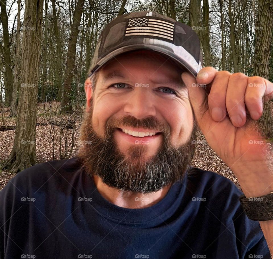 Man outdoors with a full beard.