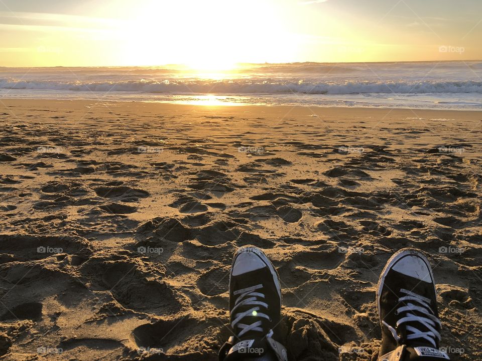 He who wears cons at the beach!