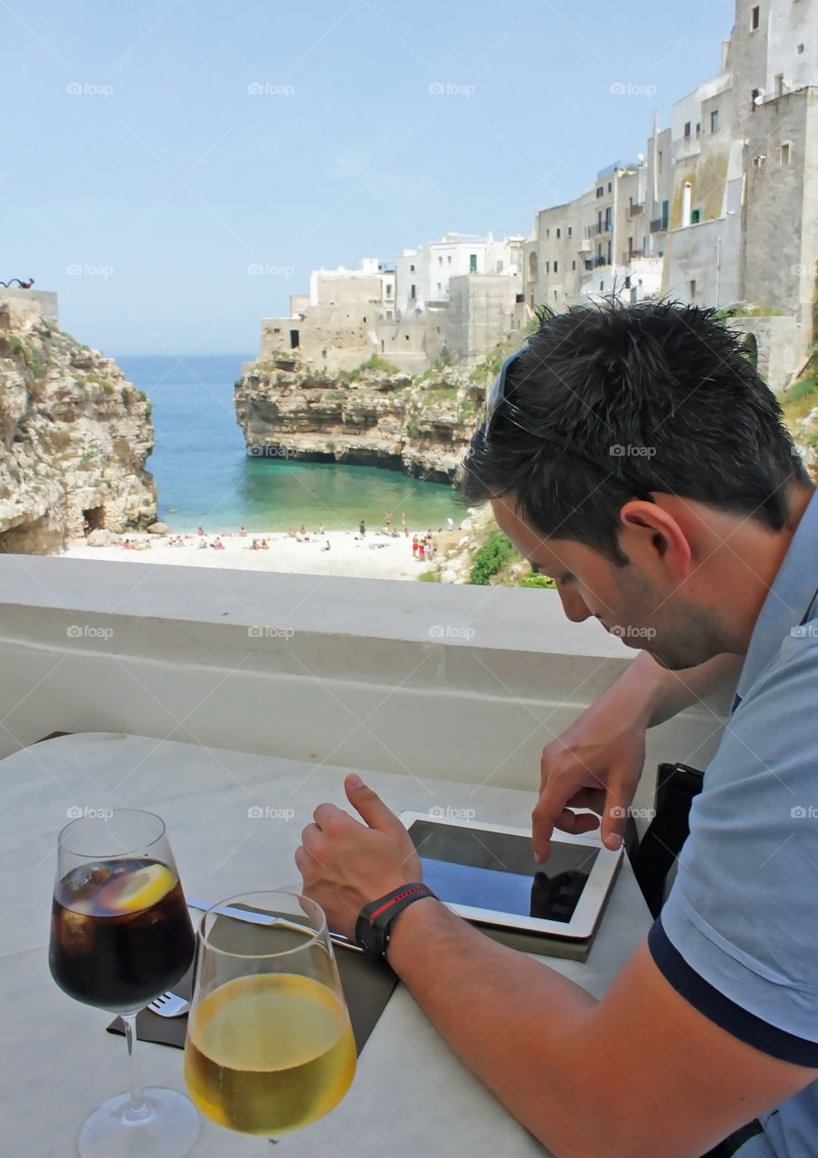Man using tablet on vacation