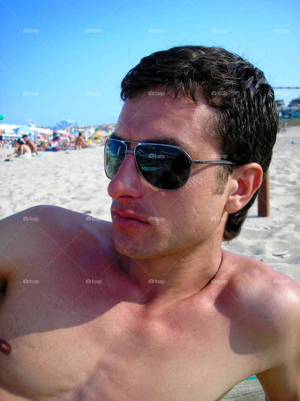 Portrait of a young man on the beach