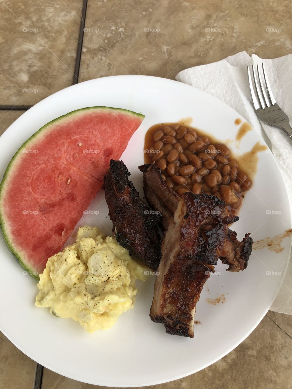 Backyard cookout ( ribs, baked beans,potato salad and Watermelon)