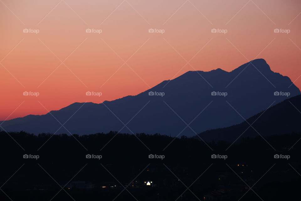 Mountain Zugna Italy silhouette orange sky