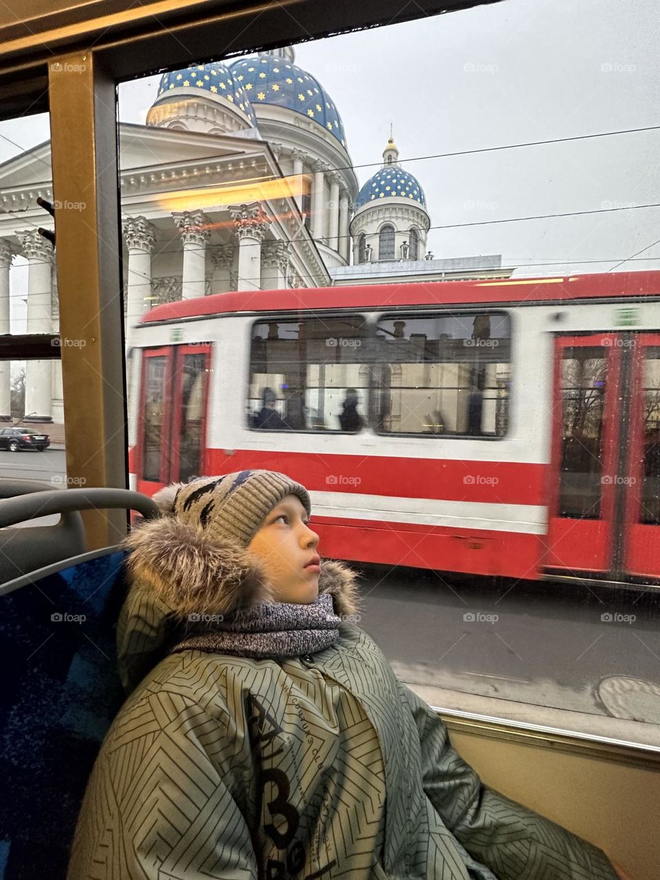 Boy looking the window in the bus