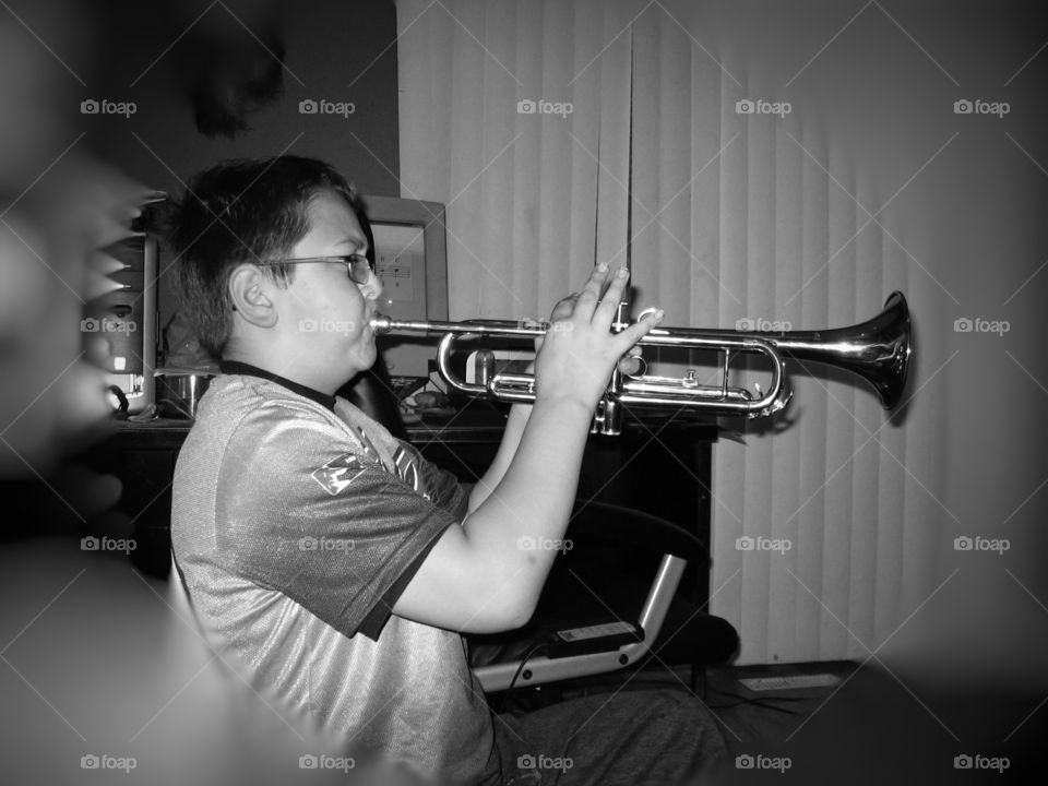 Youth practicing Trumpet. Male Youth practicing trumpet