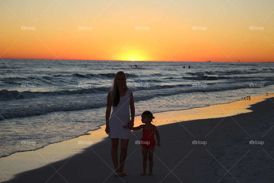 Mother daughter watching the sunset