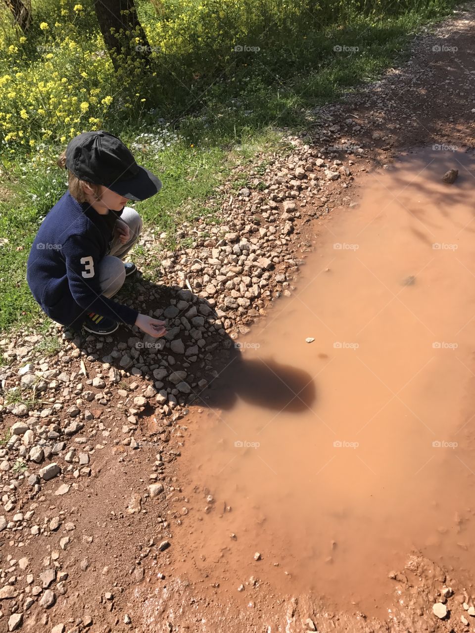 A kid in a small lake
