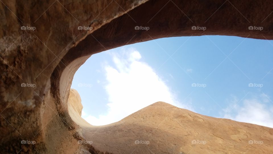 View from under a rock open to the sky