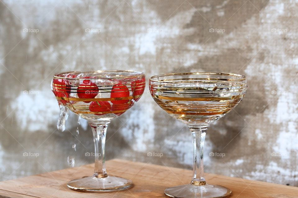 red cherry and two champagne glasses