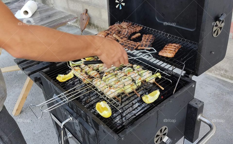 preparing food on barbecue