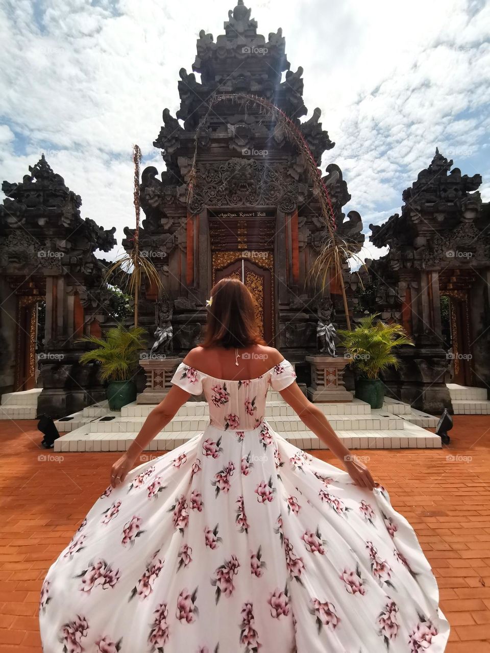 Amazing Bali architecture. Woman, summer, nice dress. Travel time.