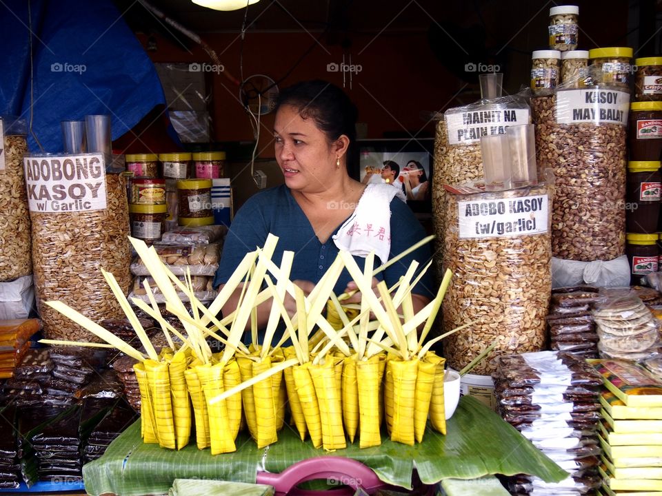 street food vendor. street food vendor selling native food, cashew and peanuts in antipolo city, philippines in asia