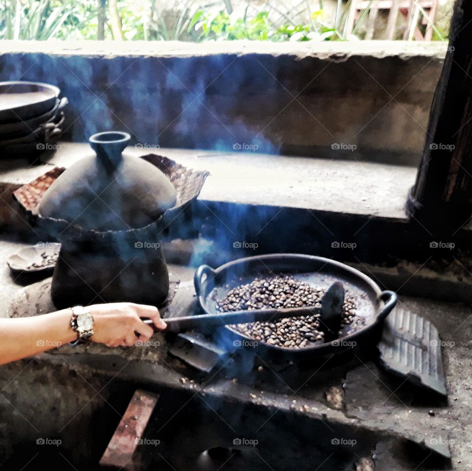 hands in frame, roasting coffee