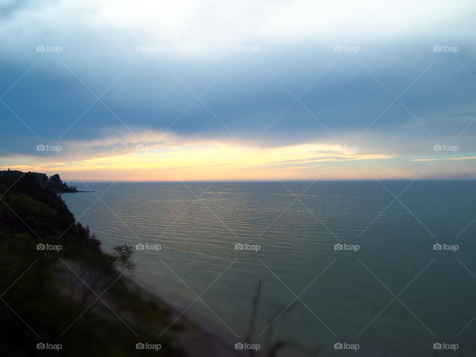 View of sunset over Lake Michigan from top of dunes