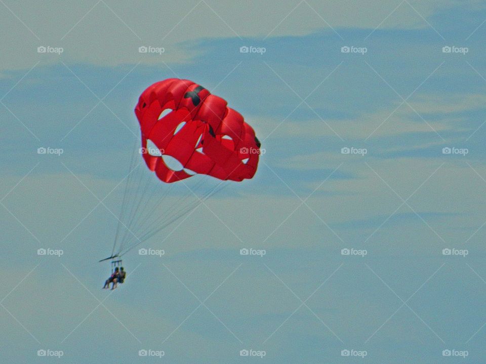 A couple parasailing - The aim of these photos is to express a concept, in order to bring forth a distinctive visual experience or elicit an emotional response from the viewer