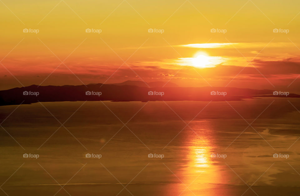 Sunlight at sunset over the sea