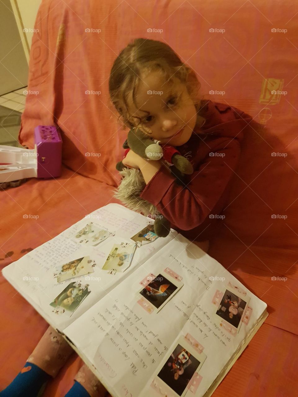 a little girl make hugs a stuffed animal