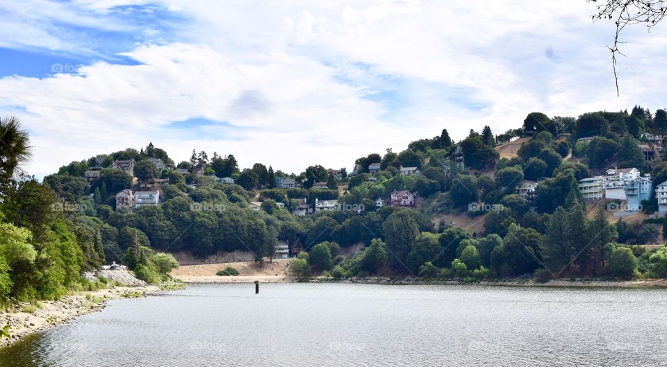 Lake Gregory in Crestline, California with a beautiful view of the homes and trees and mountains.