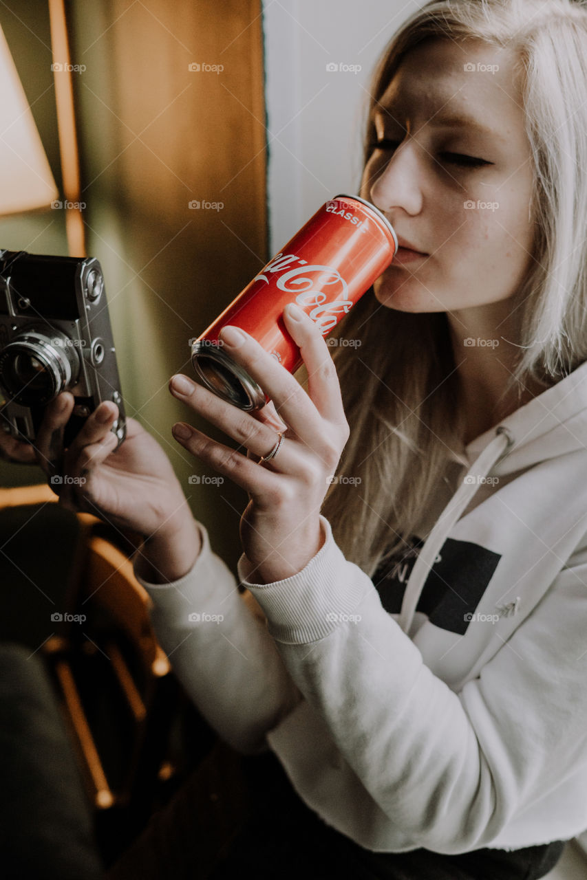 girl with a camera and coca cola