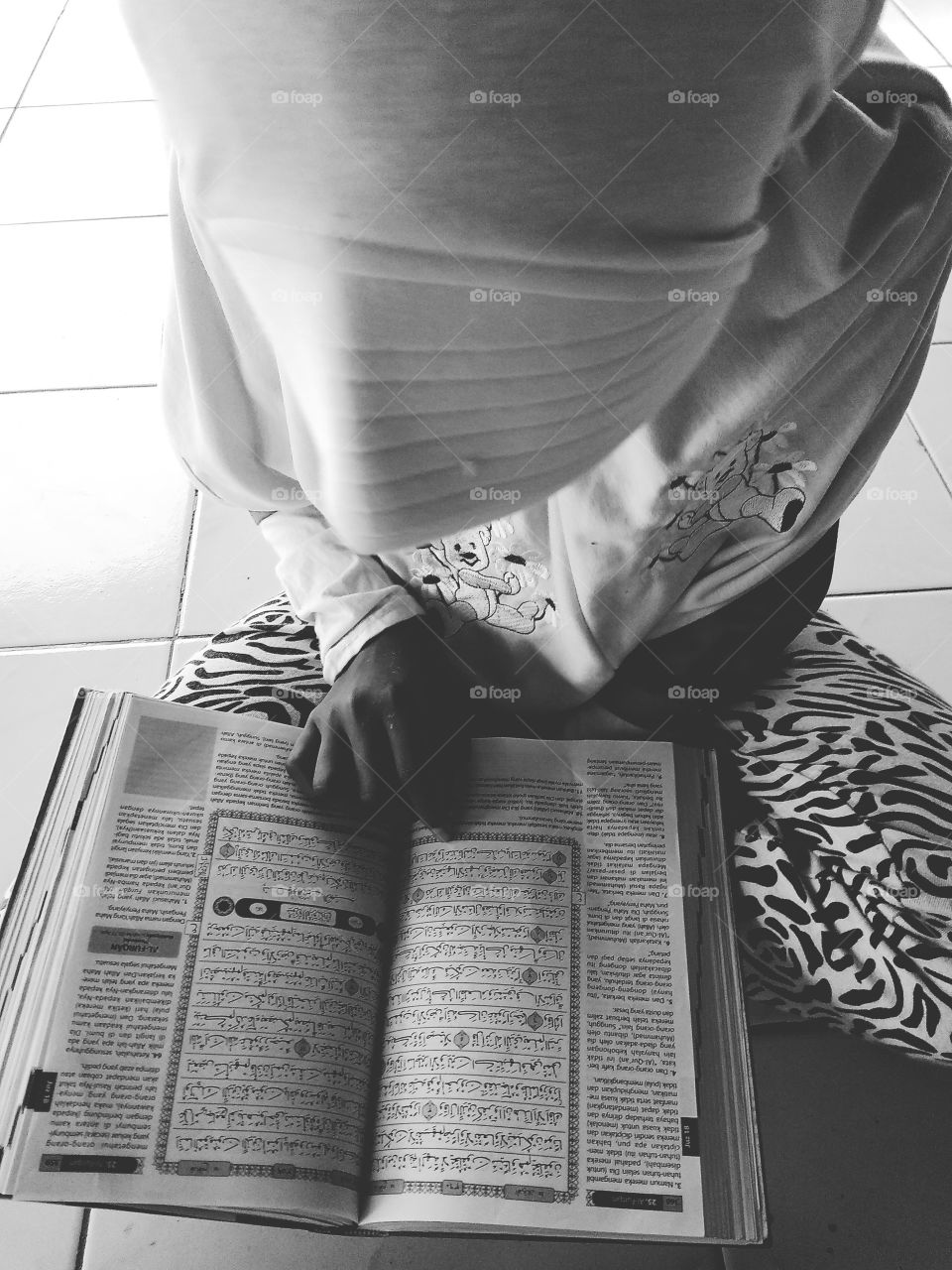 Anak membaca Al Qur'an
