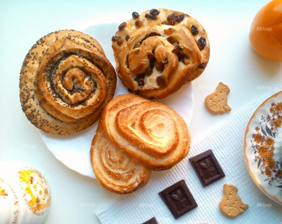 Sweets buns and cup of tea