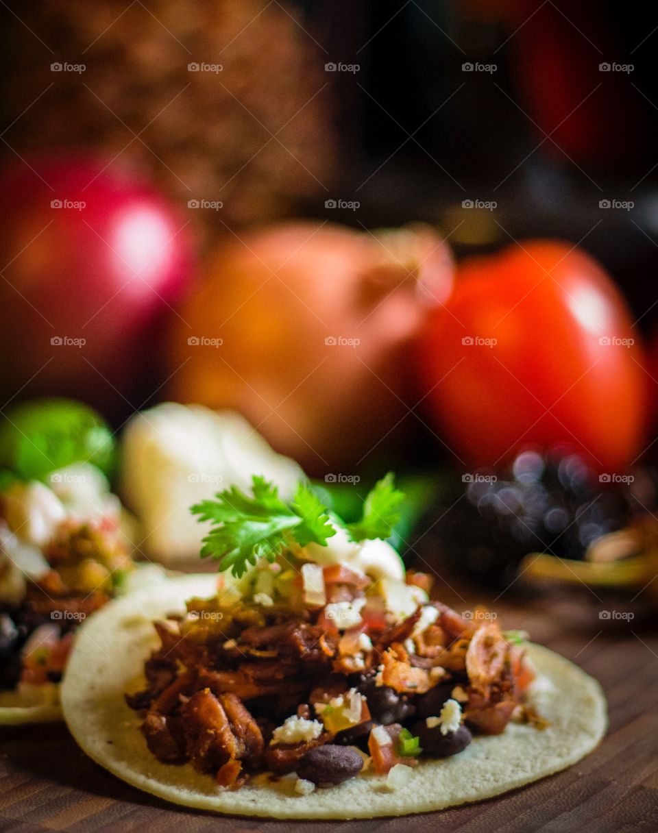 Tacos de Carnitas. Cinco de Mayo celebration cuisine: tacos with carnitas and black beans 