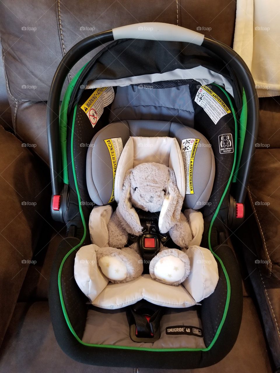 stuffed bunny belted in the carseat, baby girl got a great imagination, safety first