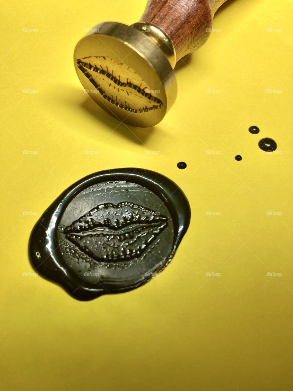 black wax seal in form of lips 