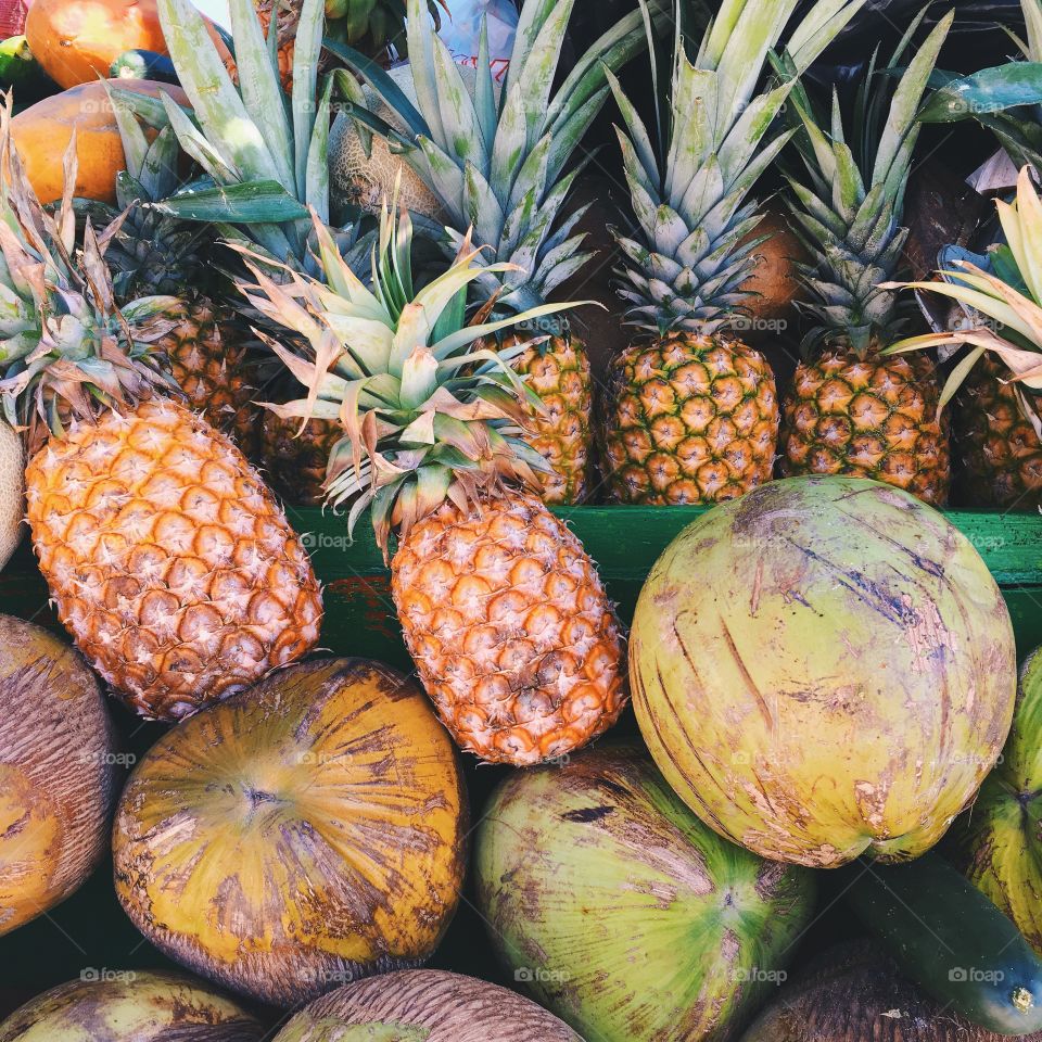 Fresh pineapple and coconuts
