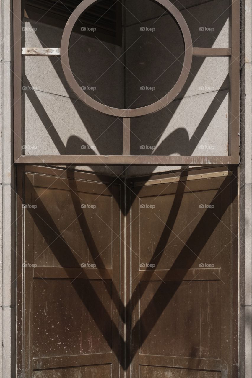 The heart shape shadow on the door 
