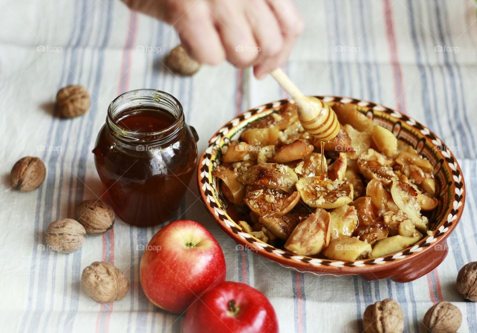 Baked apples, honey and walnuts, home cooking