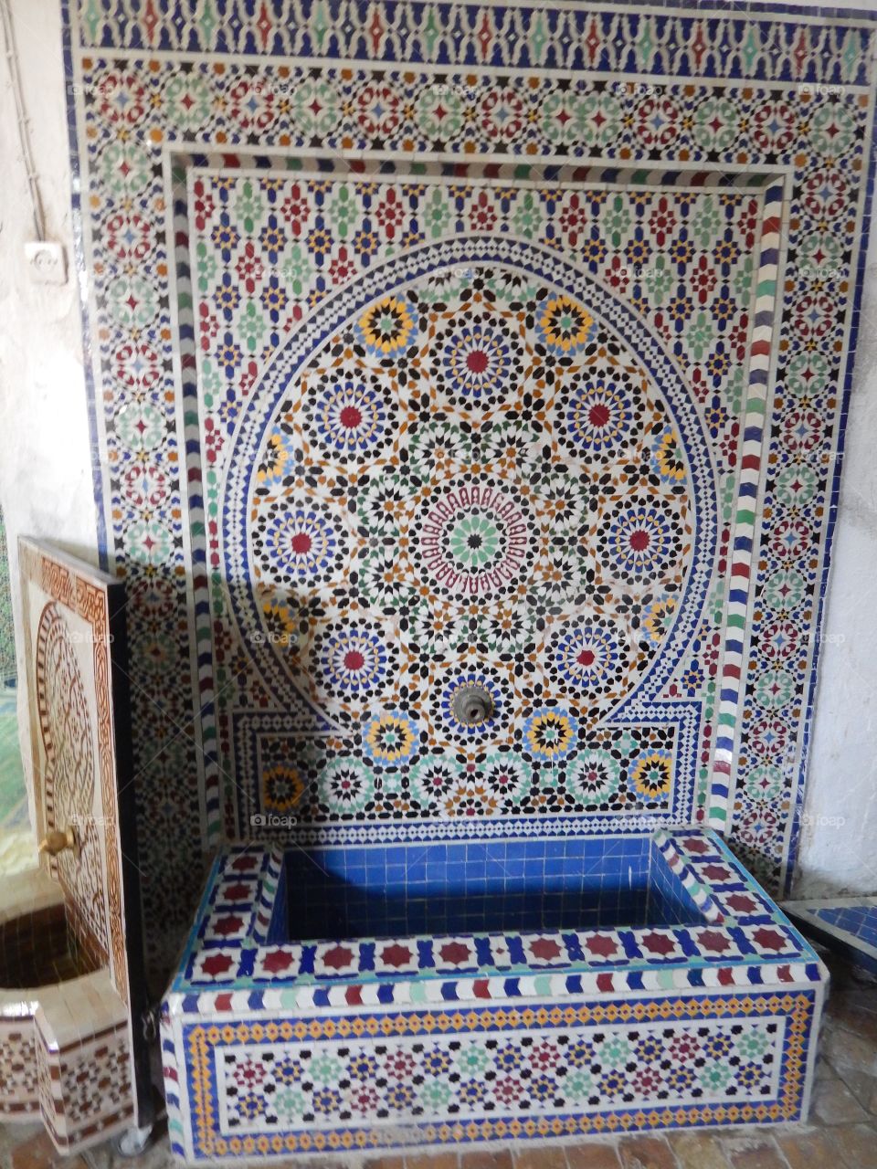 An ornate mosaic fountain made in Fez, Morocco 
