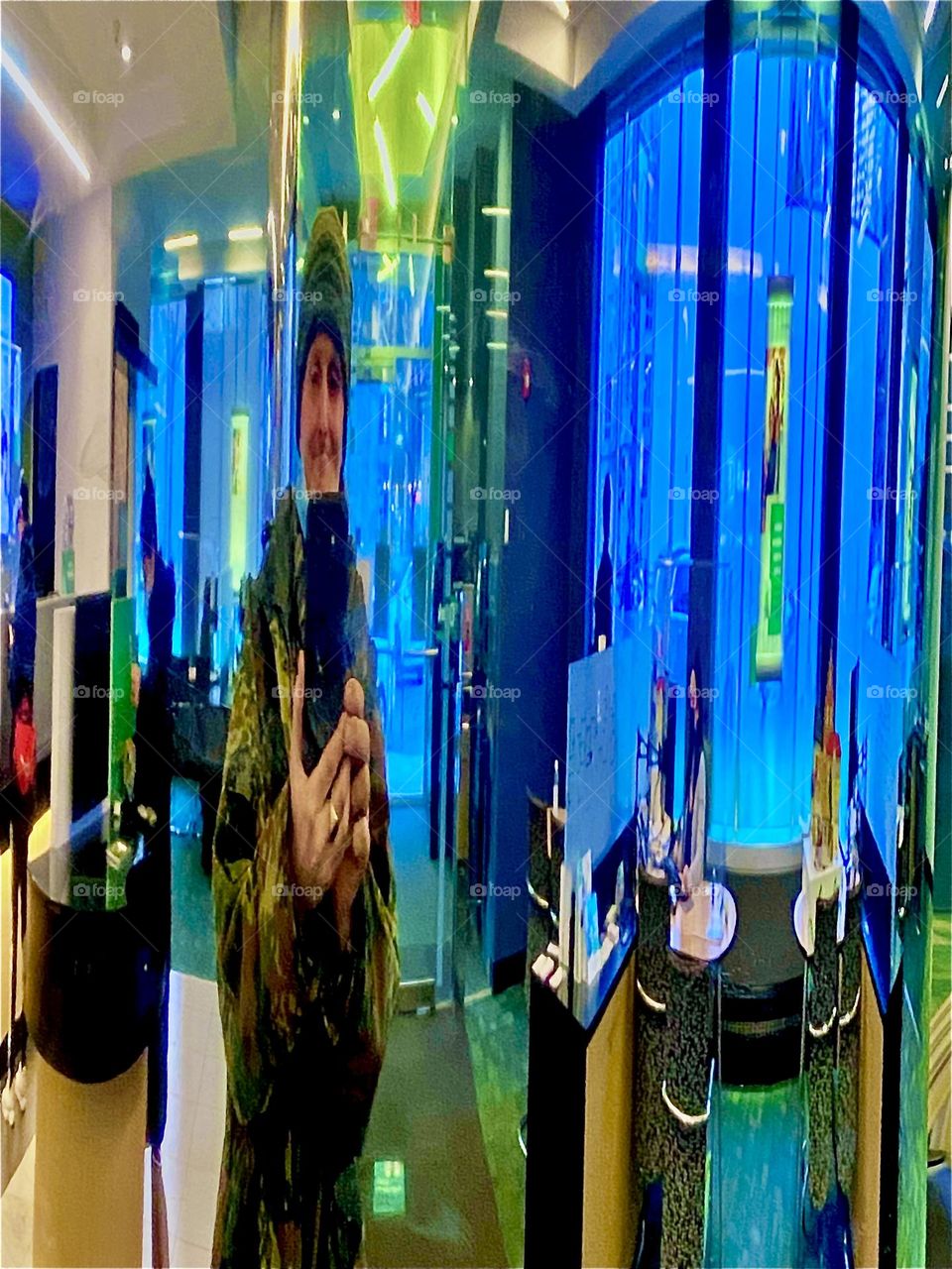 Timothy Trespas is at the bank ATM in Long Island City, Queens reflecting in a silver chrome pole. 2021. Hypnotic Productions