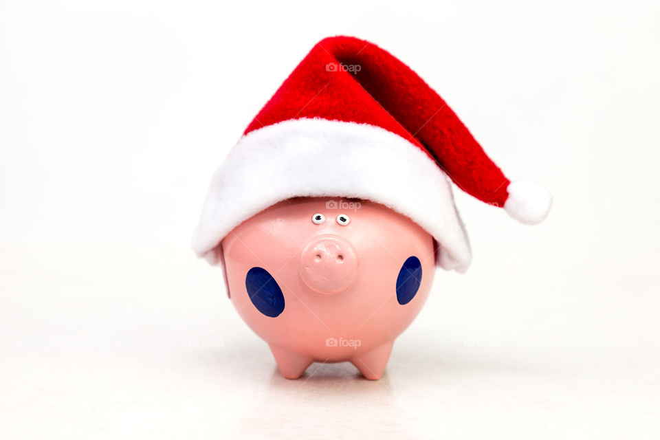 piggy bank in Santa Claus cap
