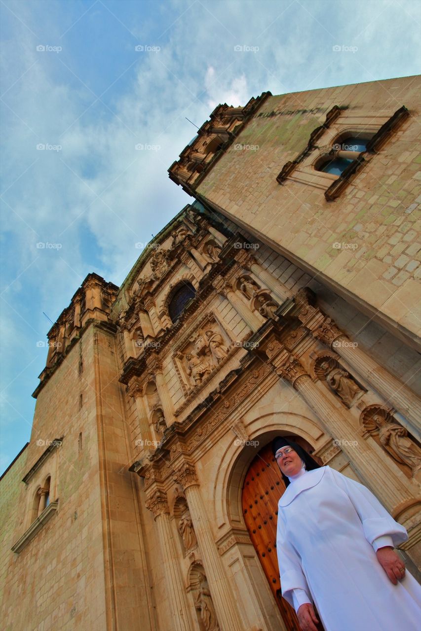 Religious sister at Oaxaca Church front entrance
