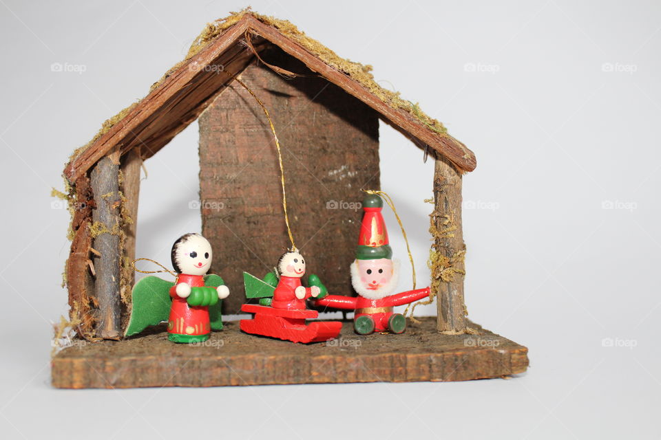 miniature toy house with Christmas figurines