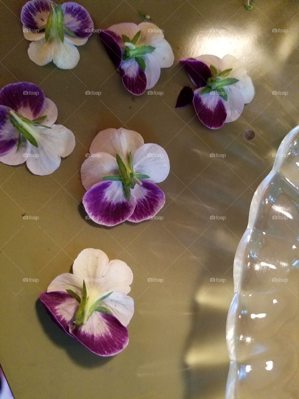 Tiny Flowers by a Plate