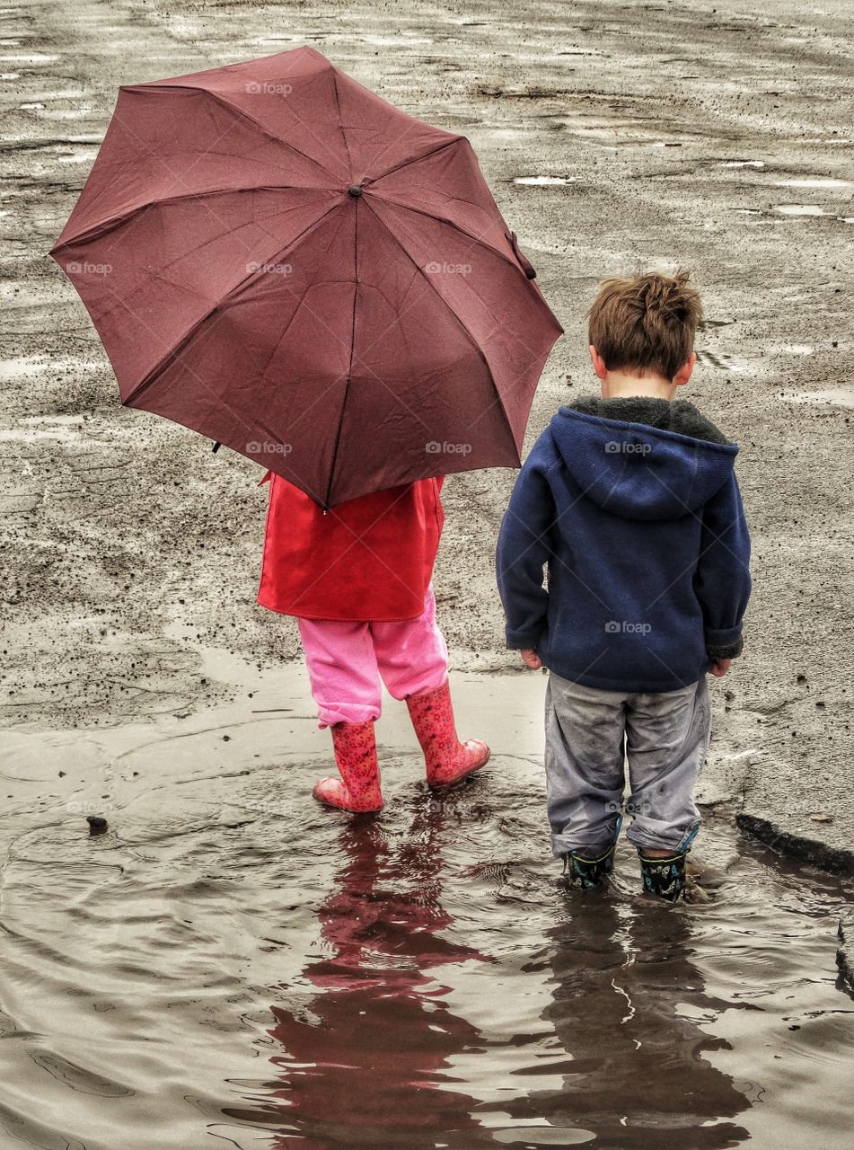 Boy And Girl And Umbrella