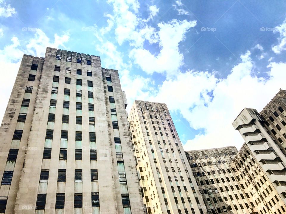 Old Charity Hospital New Orleans Art Deco abandoned building in the city with blue cloud filled sky