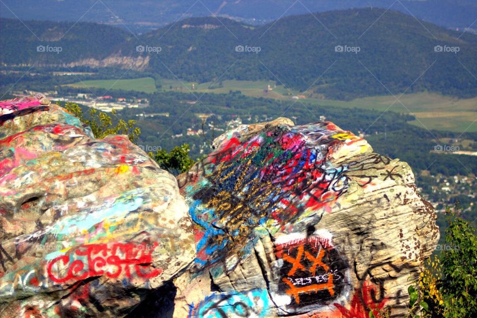 Graffiti covered rock cliffs with an amazing view. 