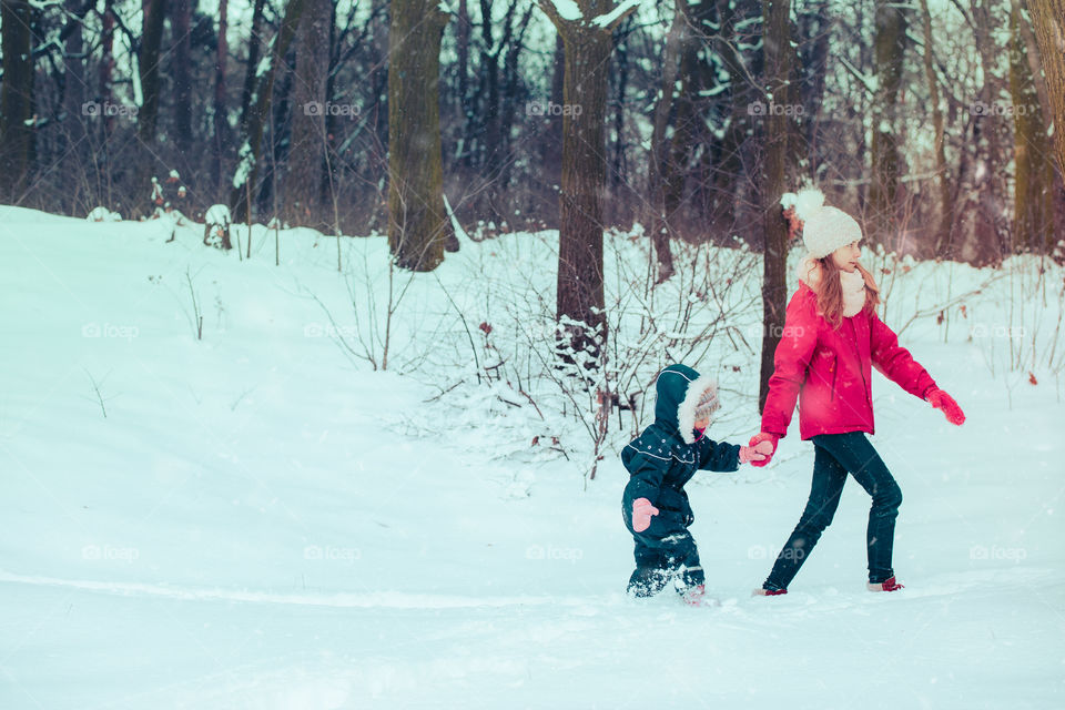 Winter with friends. Spending wintertime outdoors playing with snow