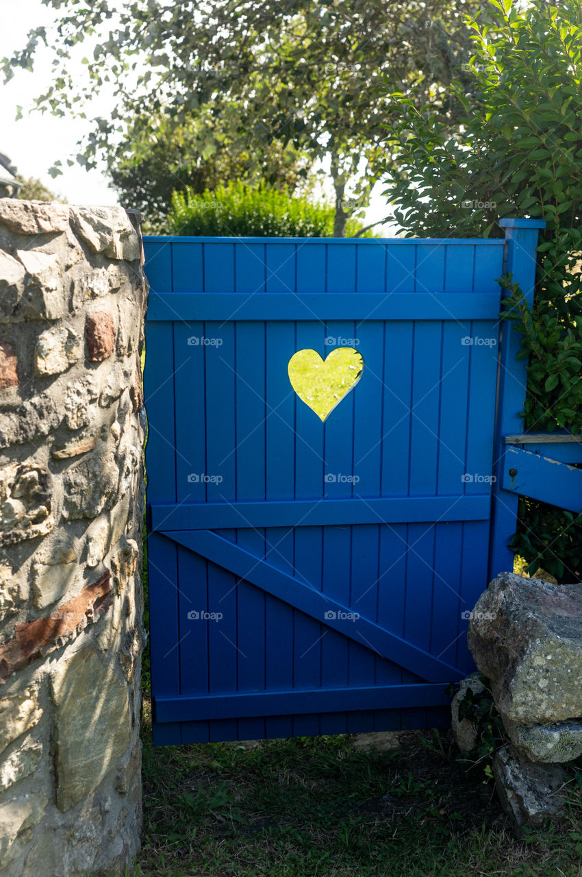 blue door with a heart
